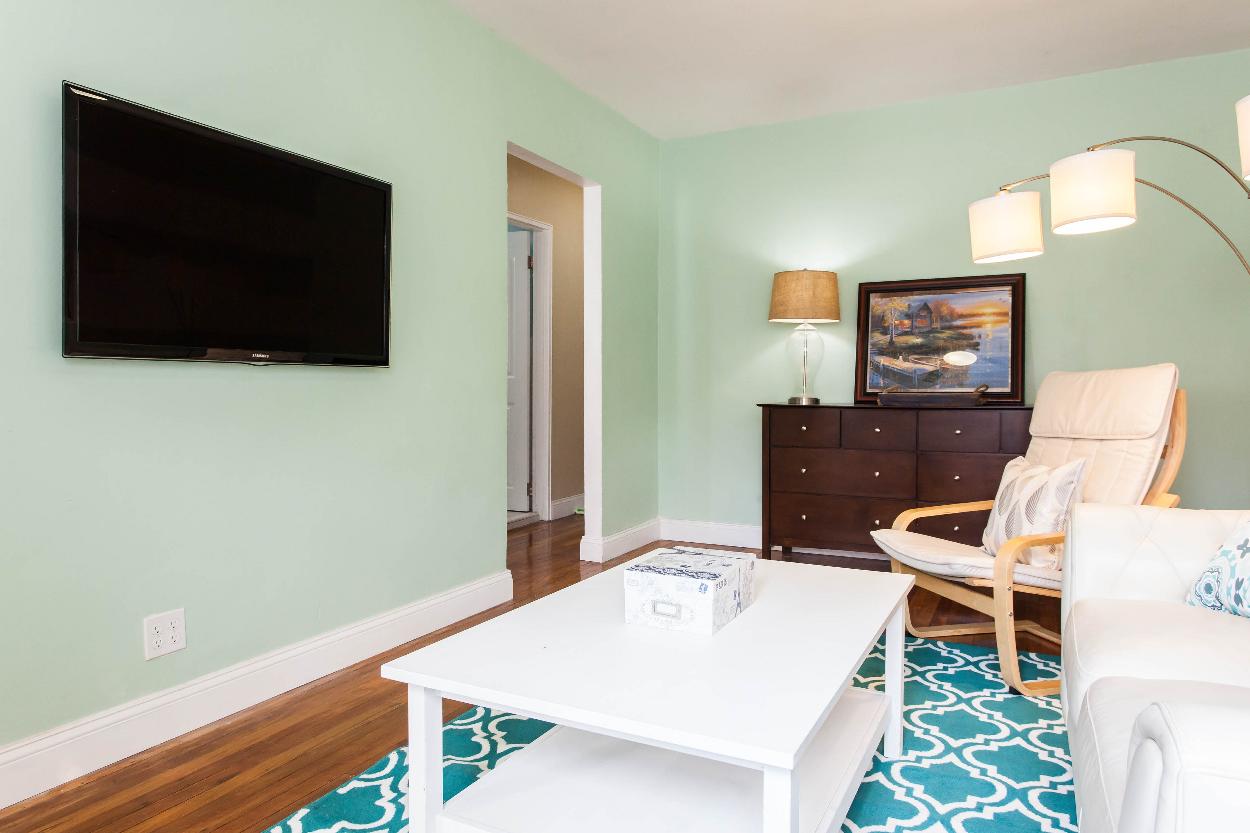 First Floor: Spacious living room with beautiful hardwood floors and plenty of natural light