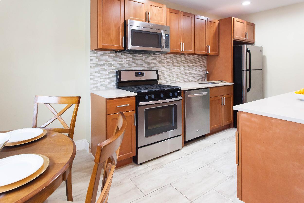 First Floor: Dining area & kitchen with stainless steel appliances, lots of counter & storage space