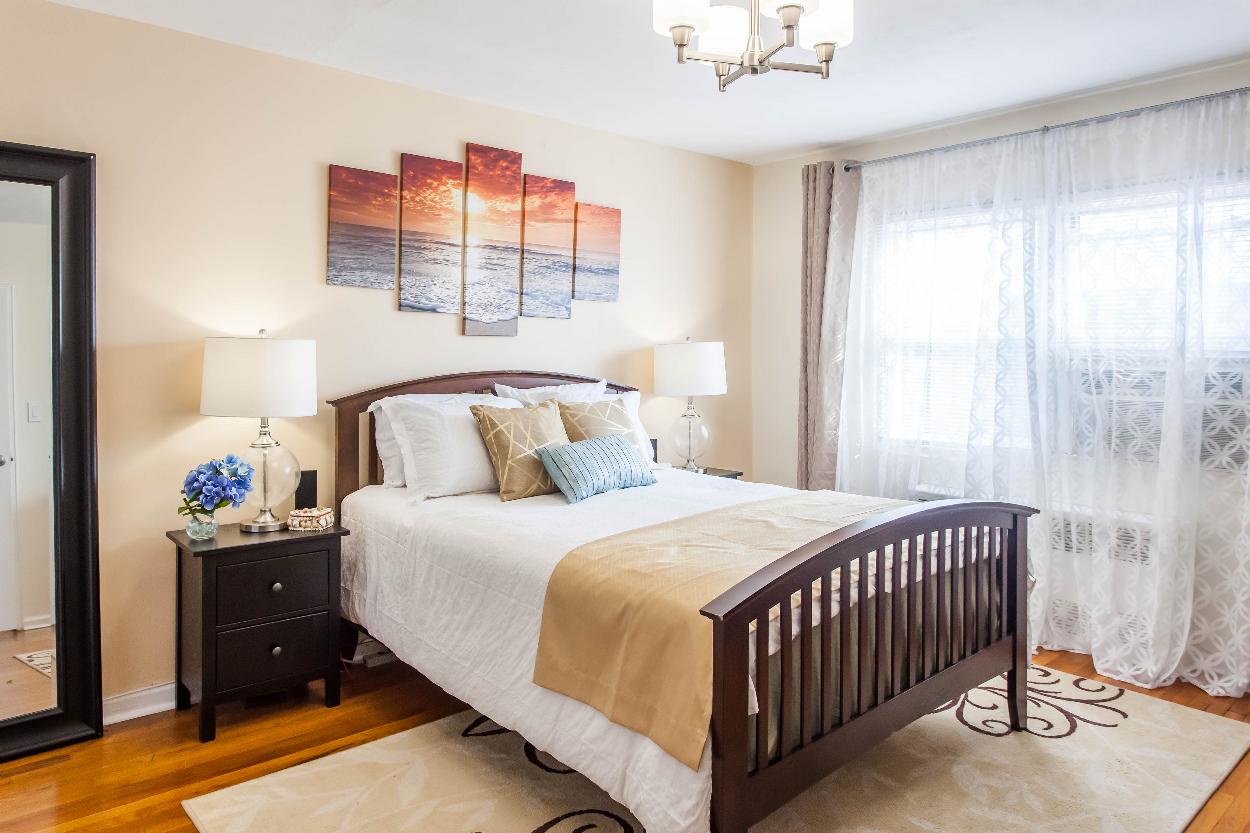 Third Floor: Spacious bedroom 1 with hardwood floors, large closet, plenty of natural light