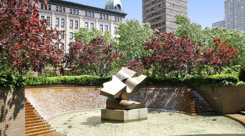 Fountain in entrance plaza, which also features two-way driveway and gardens.