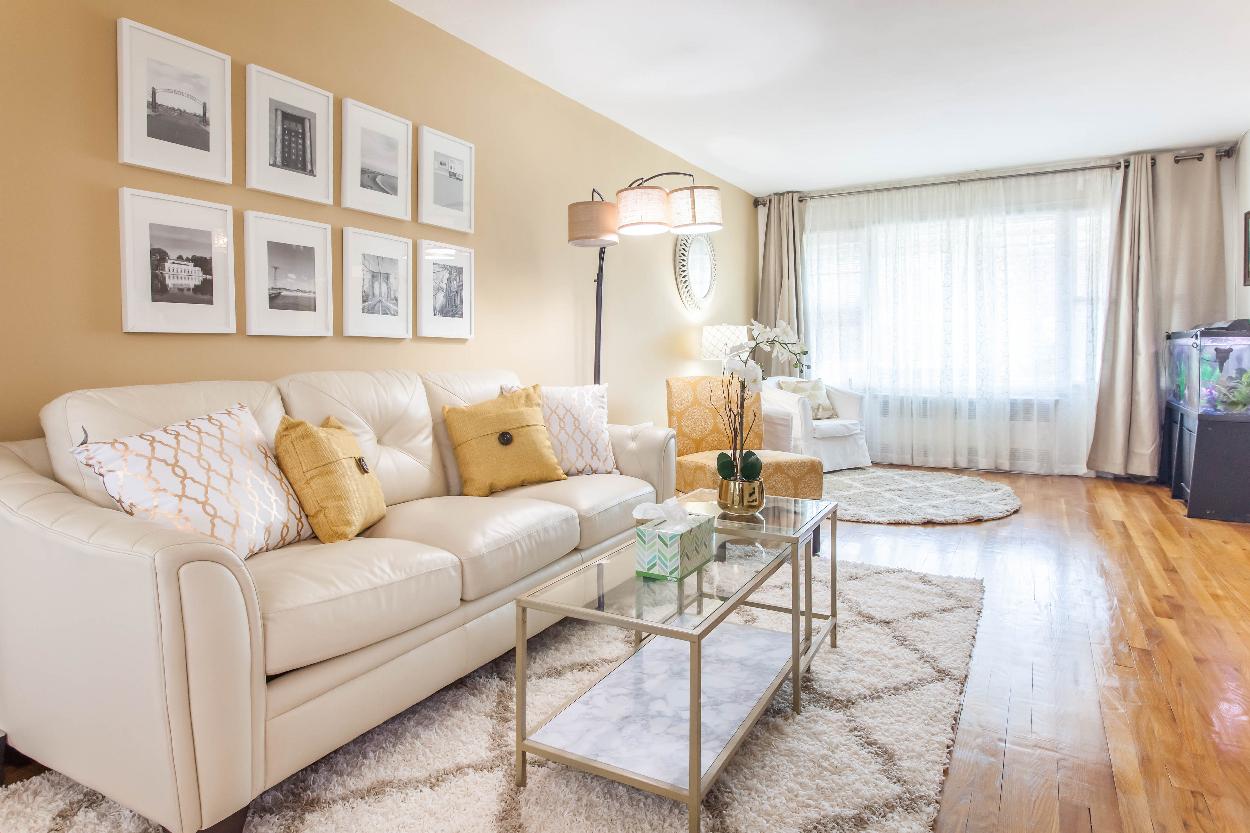 Second Floor: Spacious living room with 2 seating areas, hardwood floors, wall to wall windows