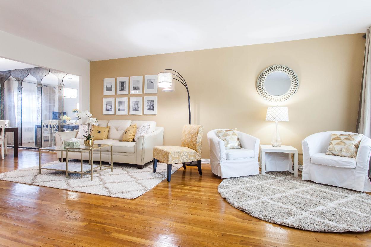 Second Floor: Spacious living room with 2 seating areas, hardwood floors, wall to wall windows