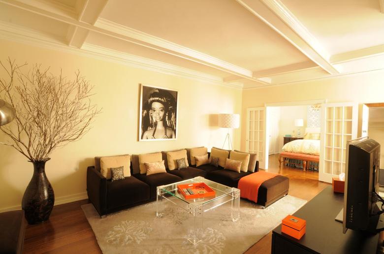 Living room with original wood-beamed coffered ceilings