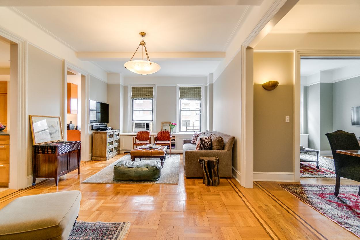 Living Room with View into Dining Room and Library/Third Bedroom
