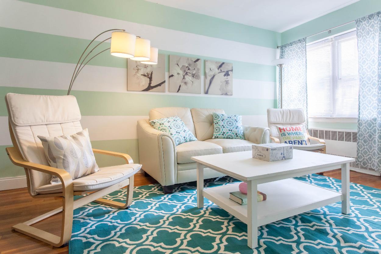 First Floor: Spacious living room with beautiful hardwood floors and plenty of natural light