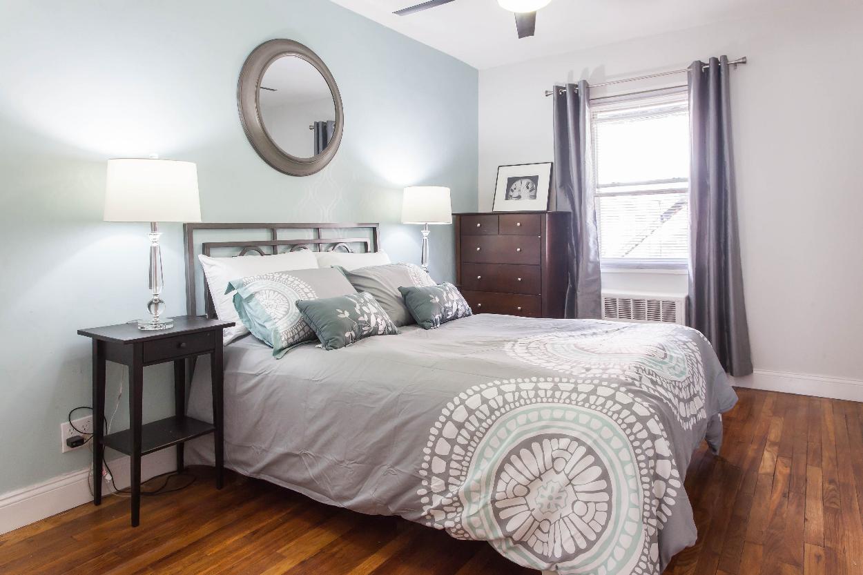 First Floor: Bedroom 2 with beautiful hardwood floors