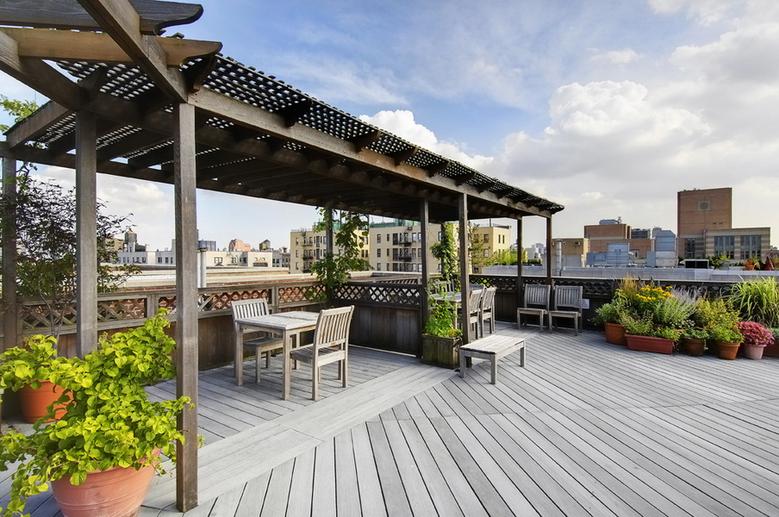 Roof deck's Adirondack seating and trellises for shade