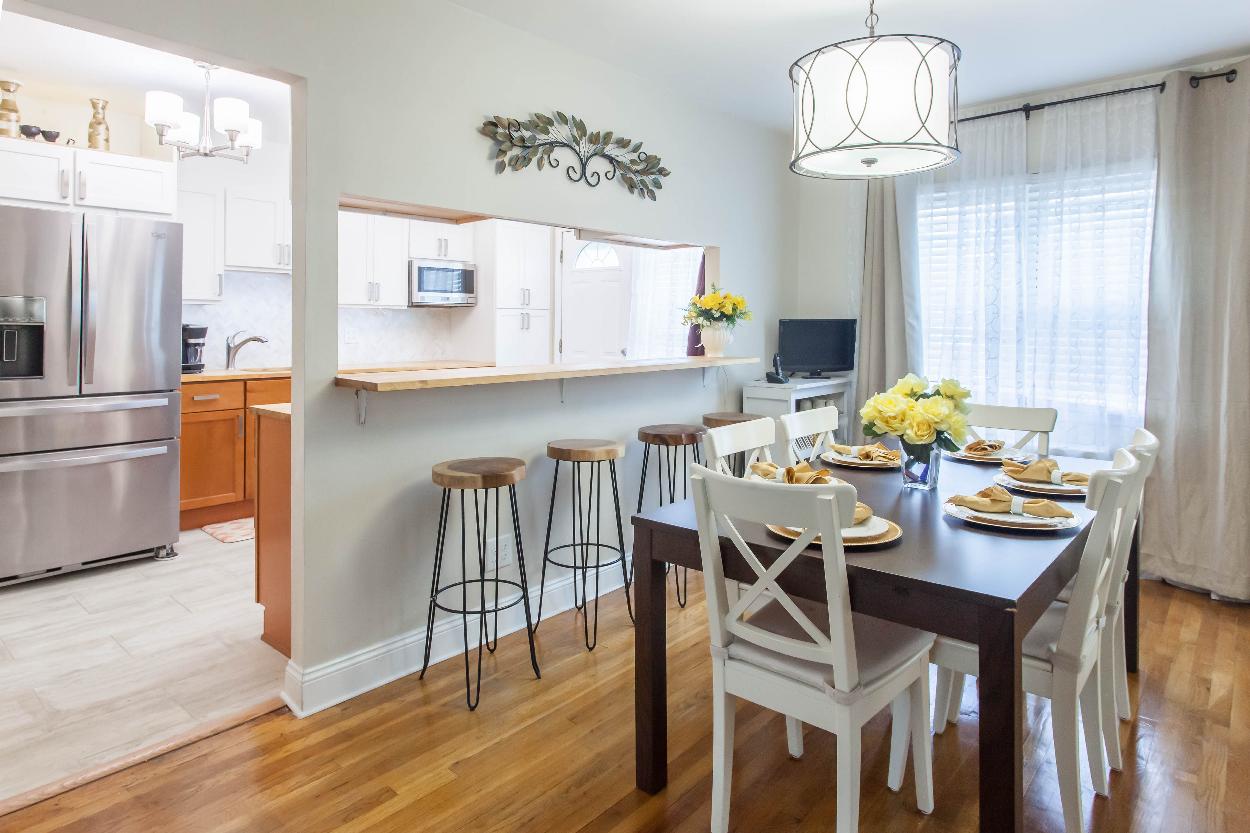 Second Floor: Dining room w passthrough to kitchen, excellent for entertaining. Whole floor sightlin