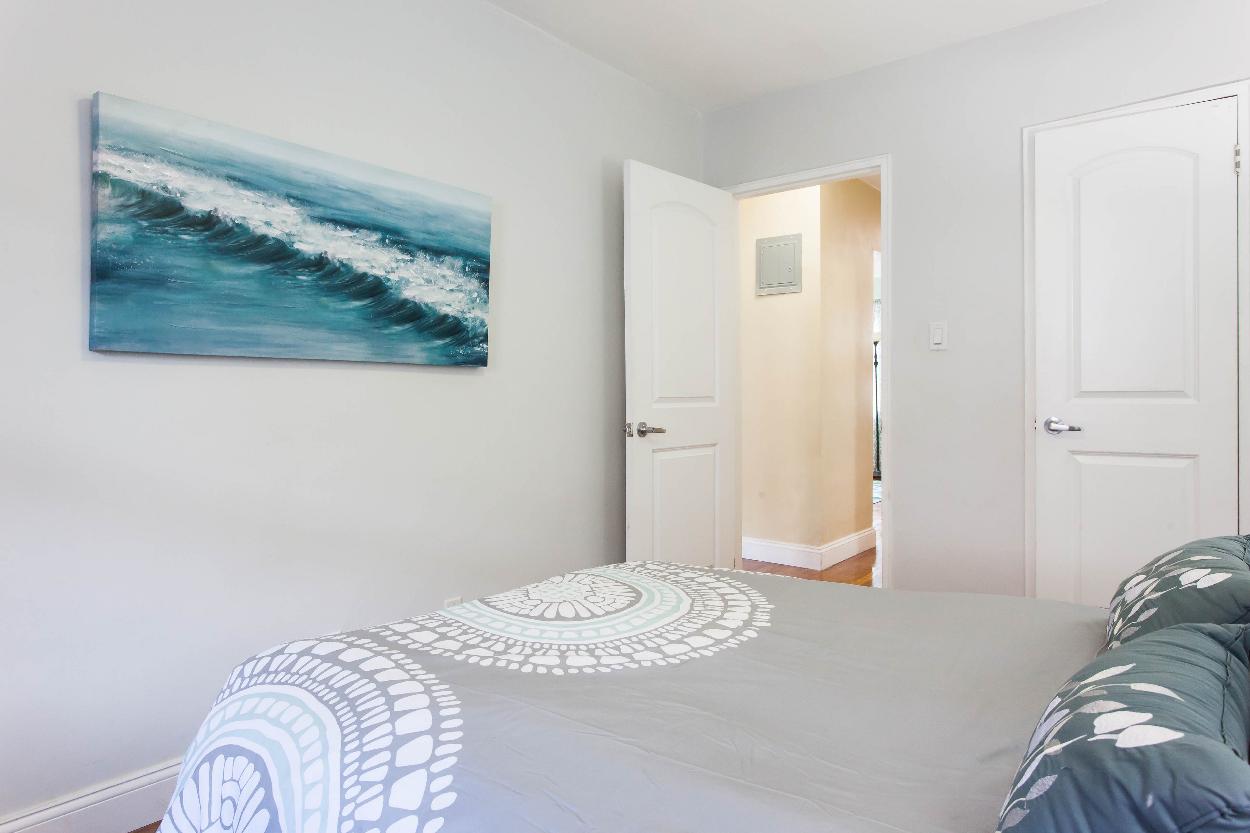 First Floor: Bedroom 2 with beautiful hardwood floors